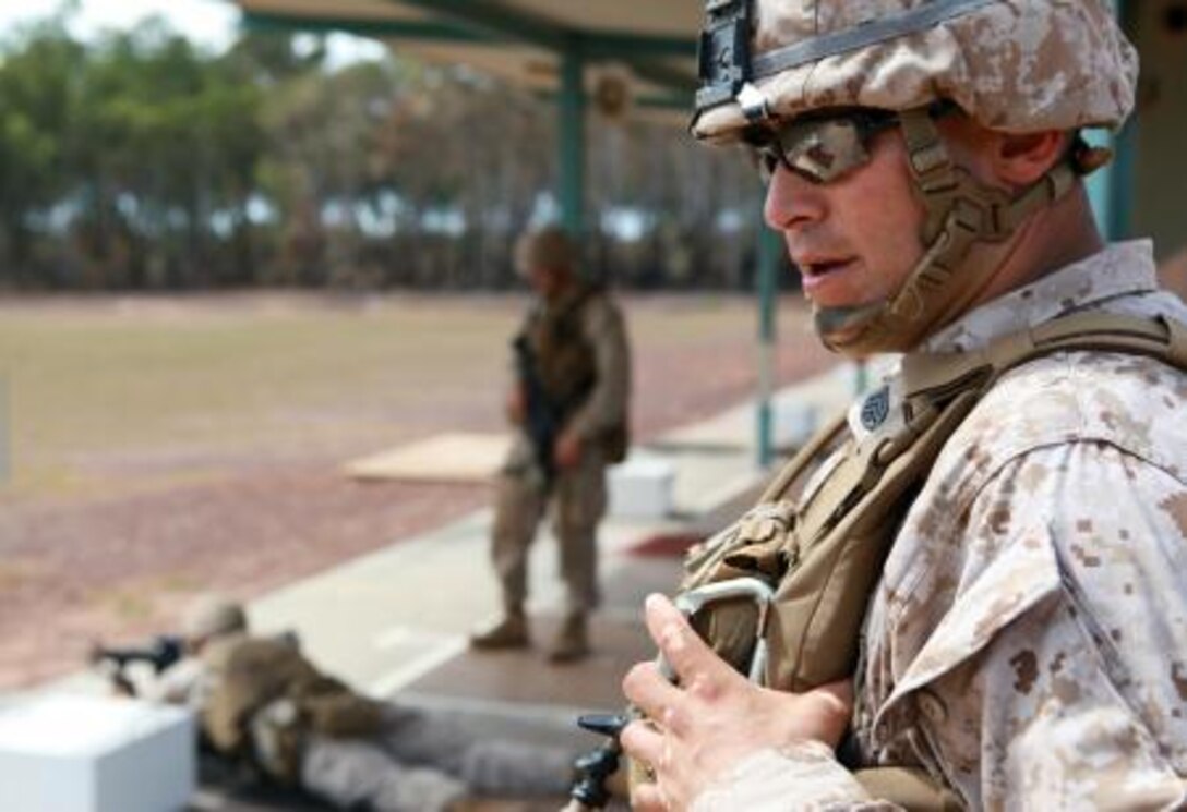 1st Sgt. William Conner, company first sergeant, Lima Company, 3rd Battalion, 3rd Marine Regiment, Marine Rotational Force – Darwin, engages his playing-card target during a poker-shoot competition, here, May 16. The rules of poker applied to the shoot, and the team who shot the best hand advanced to the next round.
