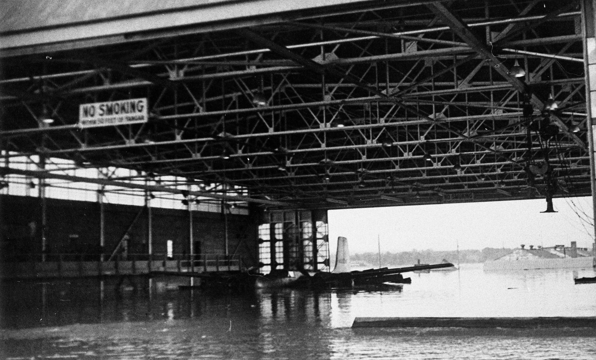 On Memorial Day, May 30, 1948, the Vanport flood engulfed the Portland Air National Guard Base, Portland, Ore. This image depicts the flooding effects of one of the base hangars several days after the flood waters breached the Columbia River. (Oregon Air National Guard historical photo). 