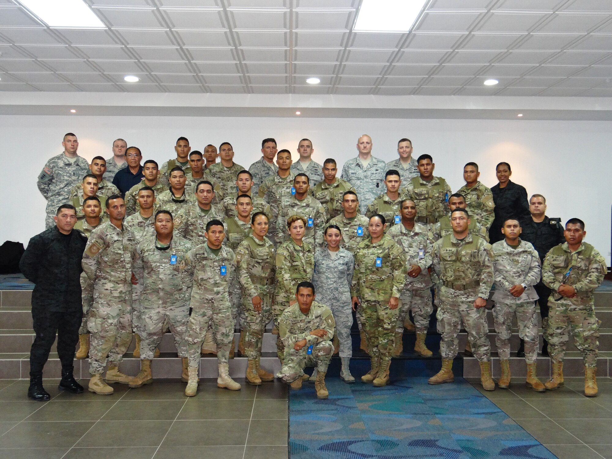 U.S. Airmen assigned to the 139th Security Forces Squadron, Missouri Air National Guard, pose for a photo with service members of  the Panamanian Public Forces (PPF) in Panama City, Panama, May 16, 2013. SFS Airmen conducted an exchange of information with the PPF. (U.S. Air National Guard photo provided by Airman 1st Class Marina Salazar/Released)