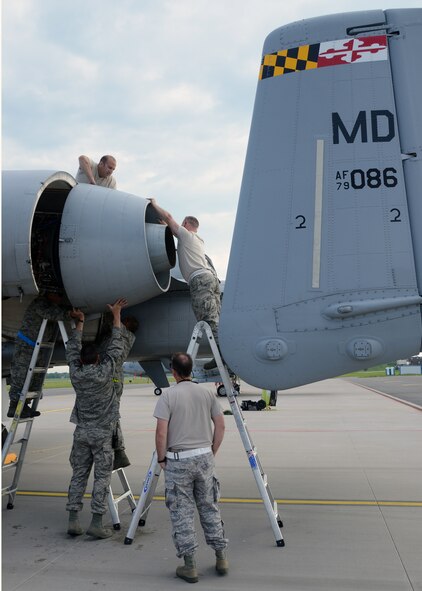 Mechanics assigned to the 175th Aircraft Maintenance Squadron, Maryland Air National Guard, put an A-10C Thunderbolt II engine back together after repairs at Amari Air Base, Estonia on June 7, 2013, during Saber Strike. Saber Strike 2013 is a multinational exercise involving approximately 2,000 personnel from 14 countries and is designed to improve NATO interoperability and strengthen the relationships between military forces of the U.S., Estonia and other participating nations. (U.S. Air National Guard photo by Staff Sgt. Benjamin Hughes)