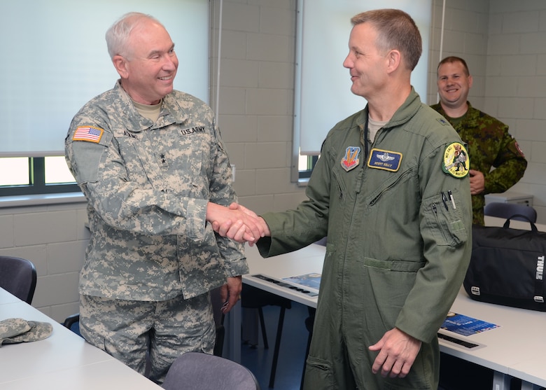 U.S. Army Maj. Gen. James Adkins, the Adjutant General for the Maryland National Guard, thanks U.S. Air Force Brig. Gen. Scott Kelly, Commander 175th Wing, Maryland Air National Guard  for a success of Saber Strike on June 5, 2013 at Amari Air Base, Estonia. Saber Strike 2013 is a multinational exercise involving approximately 2,000 personnel from 14 countries and is designed to improve NATO interoperability and strengthen the relationships between military forces of the U.S., Estonia and other participating nations. (U.S. Air National Guard photo by Staff Sgt. Benjamin Hughes)