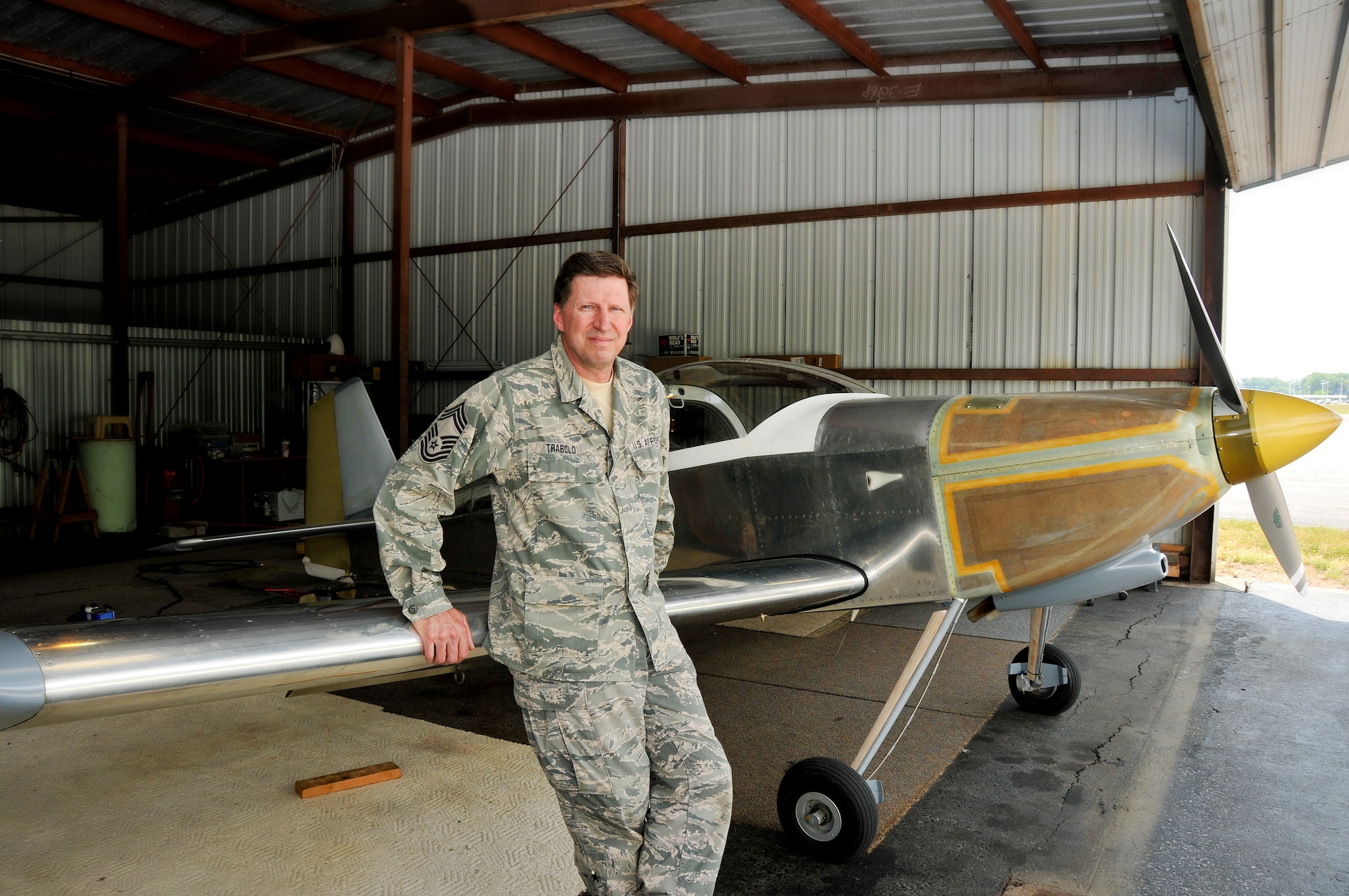 Chief Master Sgt. Jeff Trabold, 180th FW Airfield Operations Manager, pictured with his hand built Vans Aircraft RV-6. The aircraft took around 22 years to complete and was funded with Chief Trabold’s guard checks. Photo by Staff Sgt. Nicholas Kuetemeyer, Public Affairs (Released).