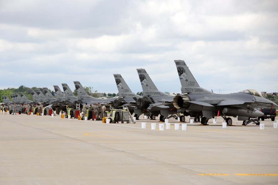SIOUX FALLS, S.D. -- F-16 aircraft are being generated on the flightline at Joe Foss Field in preparation for an Operational Readiness Exercise June 6. The exercise involves the entire base and lasts four days while testing the Airmen’s preparedness to deploy and do their jobs while in a wartime environment. (Air National Guard photo by Staff Sgt. Smeenk/Released)