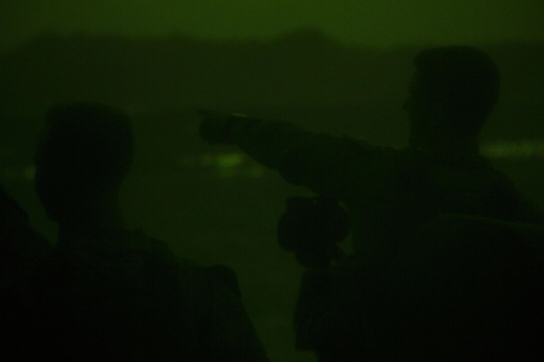 U.S. Marines assigned to the 26th Marine Expeditionary Unit (MEU), utilize an observational optic to provide security aboard the USS Kearsarge (LHD 3), as it transits through the Straits of Tiran towards Jordan, June 6, 2013.  The 26th MEU is a Marine Air-Ground Task Force forward-deployed to the U.S. 5th Fleet area of responsibility aboard the Kearsarge Amphibious Ready Group serving as a sea-based, expeditionary crisis response force capable of conducting amphibious operations across the full  range of military operations. (U.S. Marine Corps photo by Cpl. Kyle N. Runnels/Released)