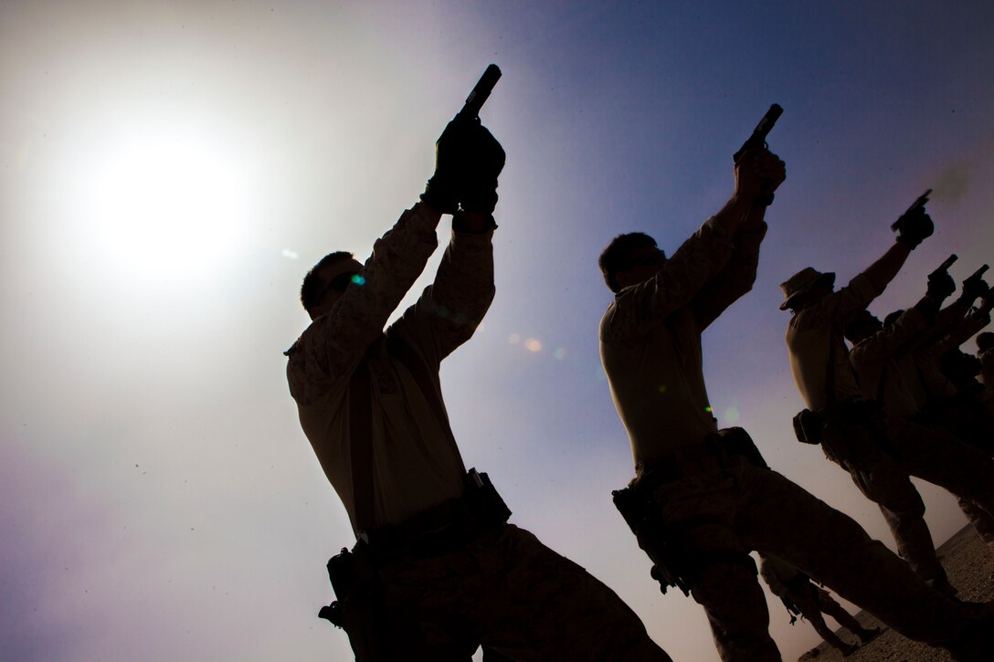 A 26th Marine Expeditionary Unit Maritime Raid Force Marine fires an M1911 MEUSOC .45 caliber pistol at a range in Jordan, June 9, 2013. Exercise Eager Lion 2013 is an annual, multinational exercise designed to strengthen military-to-military relationships and enhance security and stability in the region by responding to realistic, modern-day security scenarios. The 26th MEU is a Marine Air-Ground Task Force forward-deployed to the U.S. 5th Fleet area of responsibility aboard the Kearsarge Amphibious Ready Group serving as a sea-based, expeditionary crisis response force capable of conducting amphibious operations across the full range of military operations. (U.S. Marine Corps photograph by Sgt. Christopher Q. Stone, 26th MEU Combat Camera/Released)