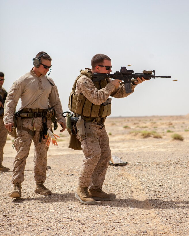 A 26th Marine Expeditionary Unit Maritime Raid Force Marine fires an M4 Carbine rifle at a range in Jordan, June 9, 2013. Exercise Eager Lion 2013 is an annual, multinational exercise designed to strengthen military-to-military relationships and enhance security and stability in the region by responding to realistic, modern-day security scenarios. The 26th MEU is a Marine Air-Ground Task Force forward-deployed to the U.S. 5th Fleet area of responsibility aboard the Kearsarge Amphibious Ready Group serving as a sea-based, expeditionary crisis response force capable of conducting amphibious operations across the full range of military operations. (U.S. Marine Corps photograph by Sgt. Christopher Q. Stone, 26th MEU Combat Camera/Released)