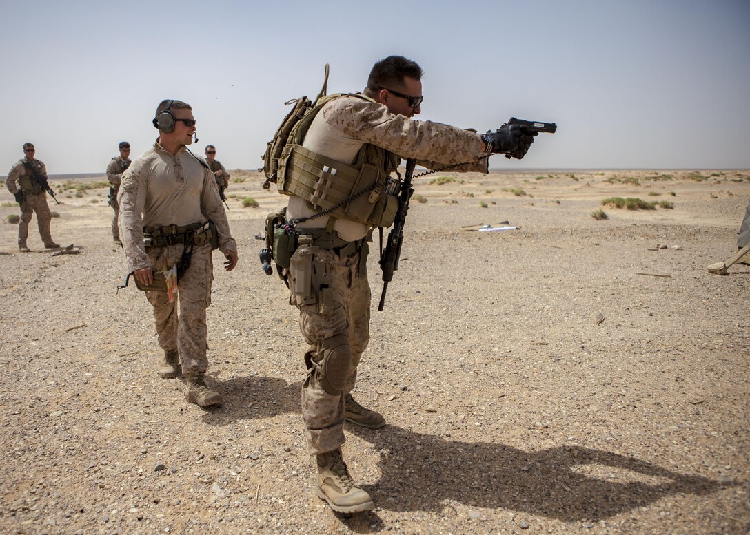 A 26th Marine Expeditionary Unit Maritime Raid Force Marine fires an M1911 MEUSOC .45 caliber pistol at a range in Jordan, June 9, 2013. Exercise Eager Lion 2013 is an annual, multinational exercise designed to strengthen military-to-military relationships and enhance security and stability in the region by responding to realistic, modern-day security scenarios. The 26th MEU is a Marine Air-Ground Task Force forward-deployed to the U.S. 5th Fleet area of responsibility aboard the Kearsarge Amphibious Ready Group serving as a sea-based, expeditionary crisis response force capable of conducting amphibious operations across the full range of military operations. (U.S. Marine Corps photograph by Sgt. Christopher Q. Stone, 26th MEU Combat Camera/Released)