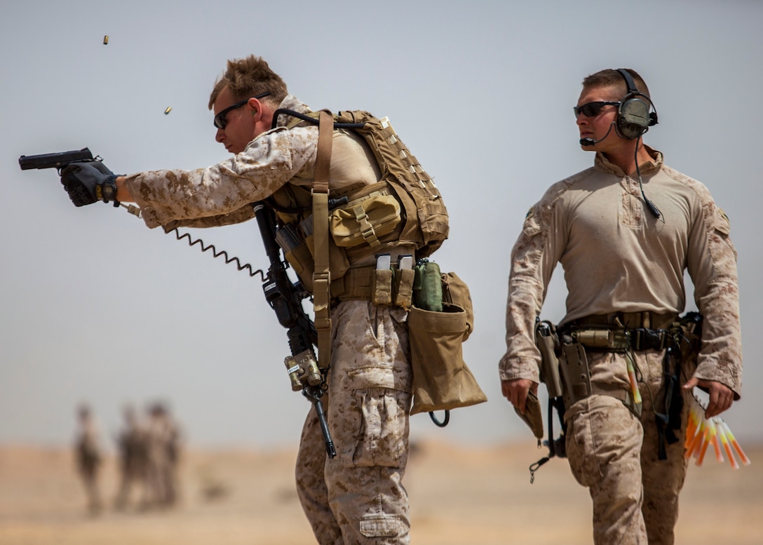 A 26th Marine Expeditionary Unit Maritime Raid Force Marine fires an M1911 MEUSOC .45 caliber pistol at a range in Jordan, June 9, 2013. Exercise Eager Lion 2013 is an annual, multinational exercise designed to strengthen military-to-military relationships and enhance security and stability in the region by responding to realistic, modern-day security scenarios. The 26th MEU is a Marine Air-Ground Task Force forward-deployed to the U.S. 5th Fleet area of responsibility aboard the Kearsarge Amphibious Ready Group serving as a sea-based, expeditionary crisis response force capable of conducting amphibious operations across the full range of military operations. (U.S. Marine Corps photograph by Sgt. Christopher Q. Stone, 26th MEU Combat Camera/Released)