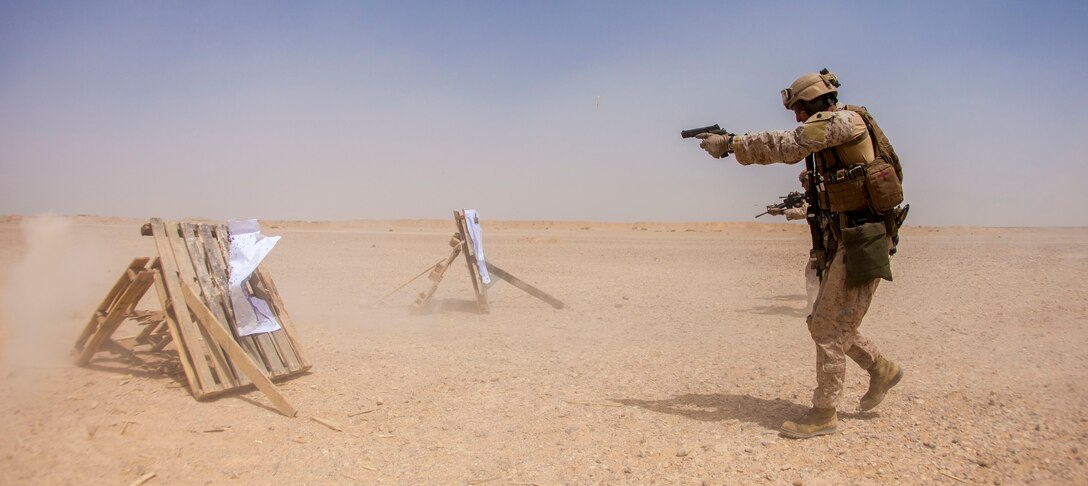 A 26th Marine Expeditionary Unit Maritime Raid Force Marine fires an M1911 MEUSOC .45 caliber pistol at a range in Jordan, June 9, 2013. Exercise Eager Lion 2013 is an annual, multinational exercise designed to strengthen military-to-military relationships and enhance security and stability in the region by responding to realistic, modern-day security scenarios. The 26th MEU is a Marine Air-Ground Task Force forward-deployed to the U.S. 5th Fleet area of responsibility aboard the Kearsarge Amphibious Ready Group serving as a sea-based, expeditionary crisis response force capable of conducting amphibious operations across the full range of military operations. (U.S. Marine Corps photograph by Sgt. Christopher Q. Stone, 26th MEU Combat Camera/Released)