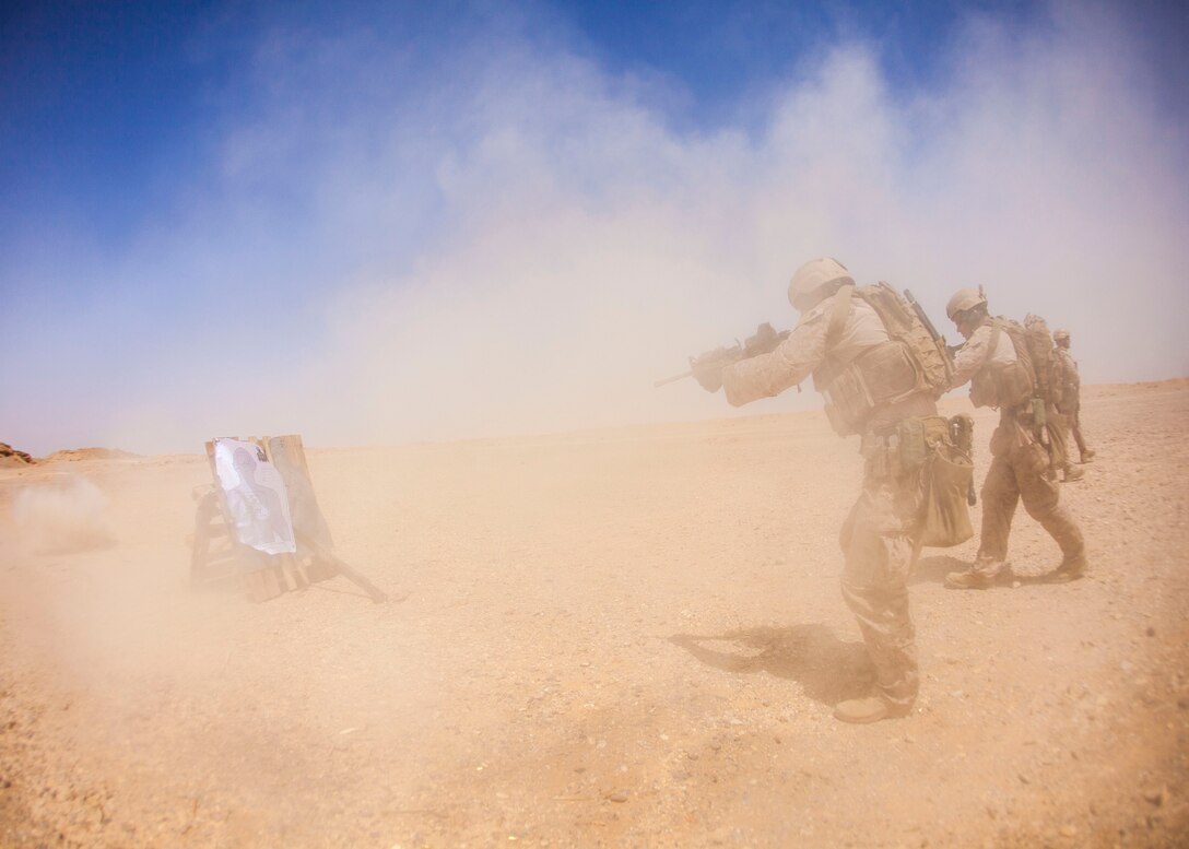 A 26th Marine Expeditionary Unit Maritime Raid Force Marine fires an M4 Carbine Rifle at a range in Jordan, June 9, 2013. Exercise Eager Lion 2013 is an annual, multinational exercise designed to strengthen military-to-military relationships and enhance security and stability in the region by responding to realistic, modern-day security scenarios. The 26th MEU is a Marine Air-Ground Task Force forward-deployed to the U.S. 5th Fleet area of responsibility aboard the Kearsarge Amphibious Ready Group serving as a sea-based, expeditionary crisis response force capable of conducting amphibious operations across the full range of military operations. (U.S. Marine Corps photograph by Sgt. Christopher Q. Stone, 26th MEU Combat Camera/Released)