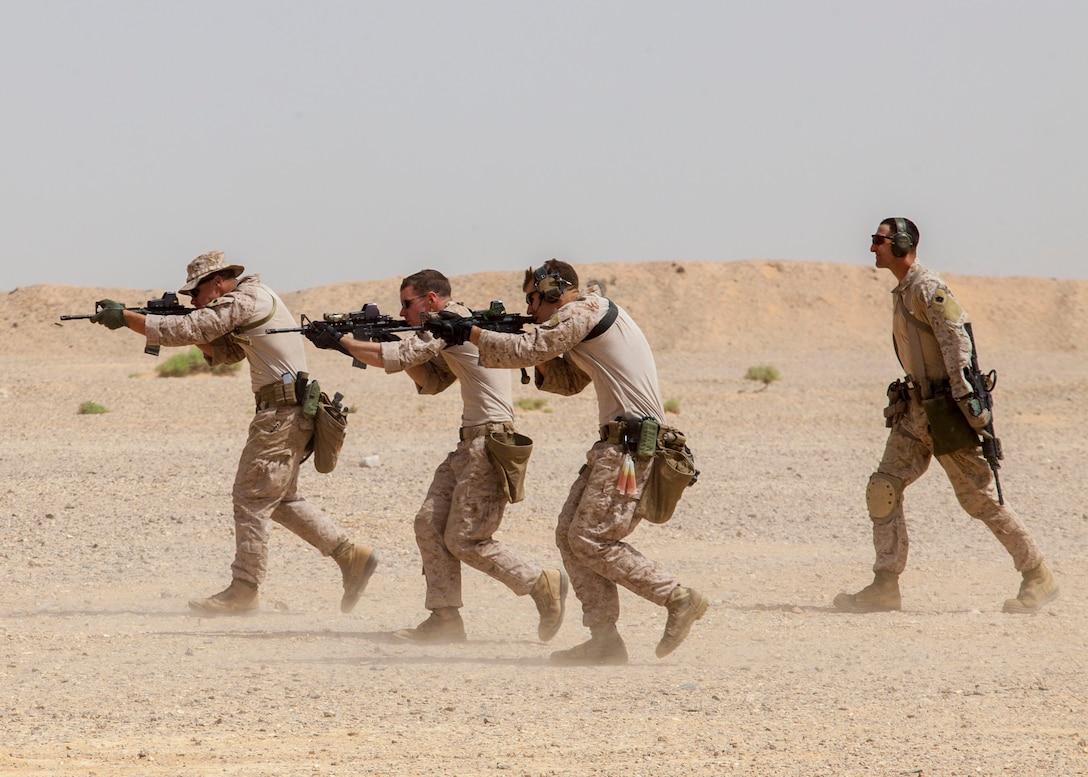 26th Marine Expeditionary Unit Maritime Raid Force Marines fire M4 Carbine rifles at a range in Jordan, June 9, 2013. Exercise Eager Lion 2013 is an annual, multinational exercise designed to strengthen military-to-military relationships and enhance security and stability in the region by responding to realistic, modern-day security scenarios. The 26th MEU is a Marine Air-Ground Task Force forward-deployed to the U.S. 5th Fleet area of responsibility aboard the Kearsarge Amphibious Ready Group serving as a sea-based, expeditionary crisis response force capable of conducting amphibious operations across the full range of military operations. (U.S. Marine Corps photograph by Sgt. Christopher Q. Stone, 26th MEU Combat Camera/Released)