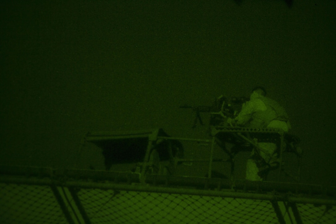 A U.S. Marine assigned to the 26th Marine Expeditionary Unit (MEU), provides security manning an M240G machine gun on an internally transported vehicle aboard the USS Kearsarge (LHD 3), as it transits through the Straits of Tiran towards Jordan, June 6, 2013.  The 26th MEU is a Marine Air-Ground Task Force forward-deployed to the U.S. 5th Fleet area of responsibility aboard the Kearsarge Amphibious Ready Group serving as a sea-based, expeditionary crisis response force capable of conducting amphibious operations across the full  range of military operations. (U.S. Marine Corps photo by Cpl. Kyle N. Runnels/Released)