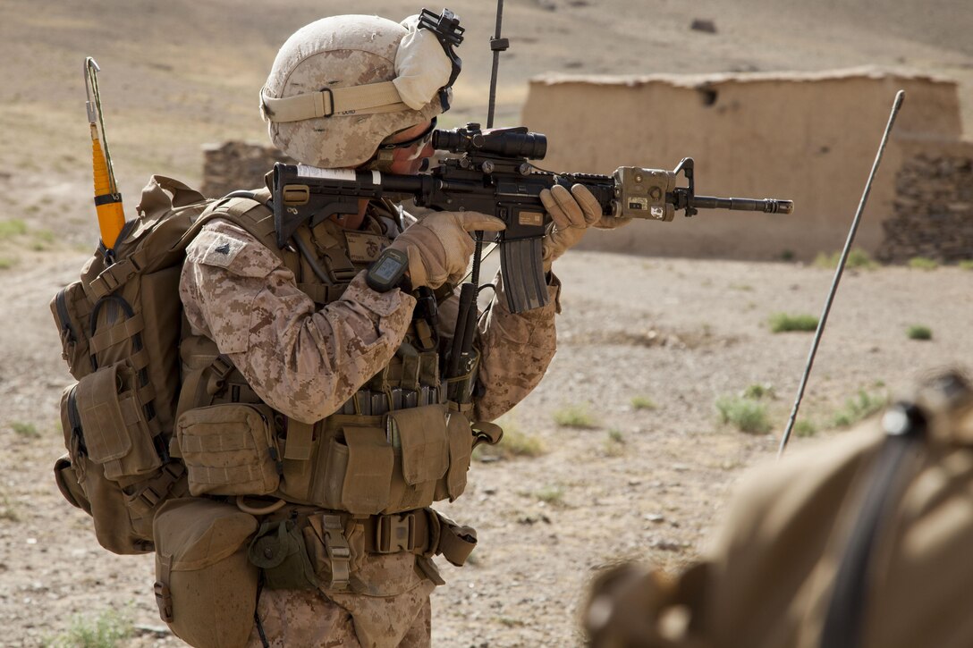U.S. Marine Corps Cpl. Derek Turner, a squad leader with Fox Company, 2nd Battalion, 8th Marines (2/8), Regimental Combat Team 7, scans the area during Operation Nightmare in Nowzad, Afghanistan, June 6, 2013. Operation Nightmare was a clearing operation led by Afghan National Security Forces and supported by the Marines of 2/8. (U.S. Marine Corps photo by Kowshon Ye/Released)