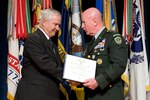 Secretary of Defense Robert M. Gates presents an award to outgoing Chief of the National Guard Bureau LTG H Steven Blum during a transition ceremony at the Pentagon, Nov. 17, 2008.