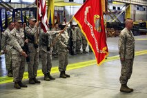 Col. Jeffrey M. Reagan (right), former chief of staff for 2nd Marine Logistics Group, waits to be presented the Legion of Merit award during a retirement ceremony at 2nd Maintenance Battalion’s maintenance bay aboard Camp Lejeune, N.C., June 7, 2013. Reagan was commissioned as an officer in 1988, and served in the Marine Corps for 25 years. 