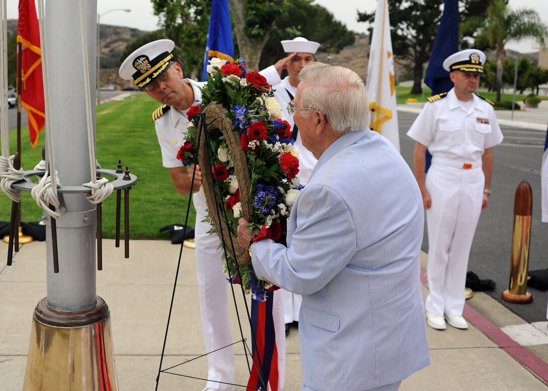 Capt. Kenneth Iverson, the Naval Hospital Camp Pendleton commanding officer, and Retired Lt. Cmdr. Richard J. Nowatzki, who served aboard the USS Hornet during the Battle of Midway, place a wreath at base of the hospital’s flag pole during the hospital’s 71st commemoration of the Battle of Midway June 5.  Nowatzki, a native of Freeport, Ill., enlisted in the Navy August 1941 and was a plank owner of the Hornet.  While serving onboard Hornet he was part of many historical events including the Doolittle Raid, the Battle of Midway and he was one of the last crewmen to abandon her when the Hornet sank during the Battle of the Santa Cruz Islands Oct. 27, 1942.  (U.S. Navy photo by Mass Communication Specialist 1st Class Michael R. McCormick)
