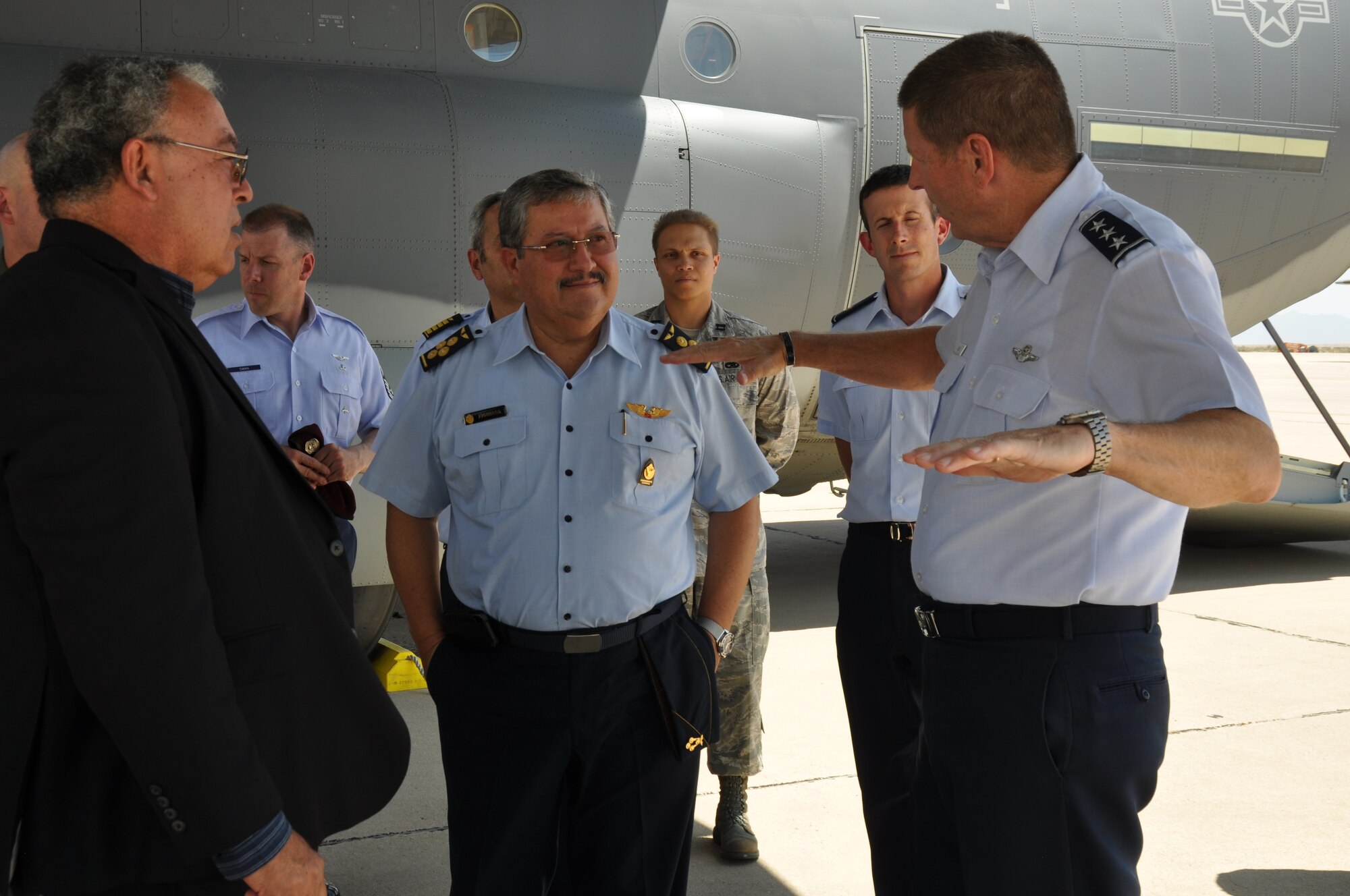 Air General Jaime Figueroa, Commanding General, Peruvian Air Force and Lt. Gen. Robin Rand, 12th Air Force (Air Forces Southern) commander, discuss the capabilities of a C-130J here, June 10. The Peruvian Air delegation is at D-M for discussions relating to building partnership capacity, countering transnational organized crime, and humanitarian assistance and disaster response in the U.S. Southern Command area of responsibility (USAF photo by Master Sgt. Kelly Ogden/Released).  