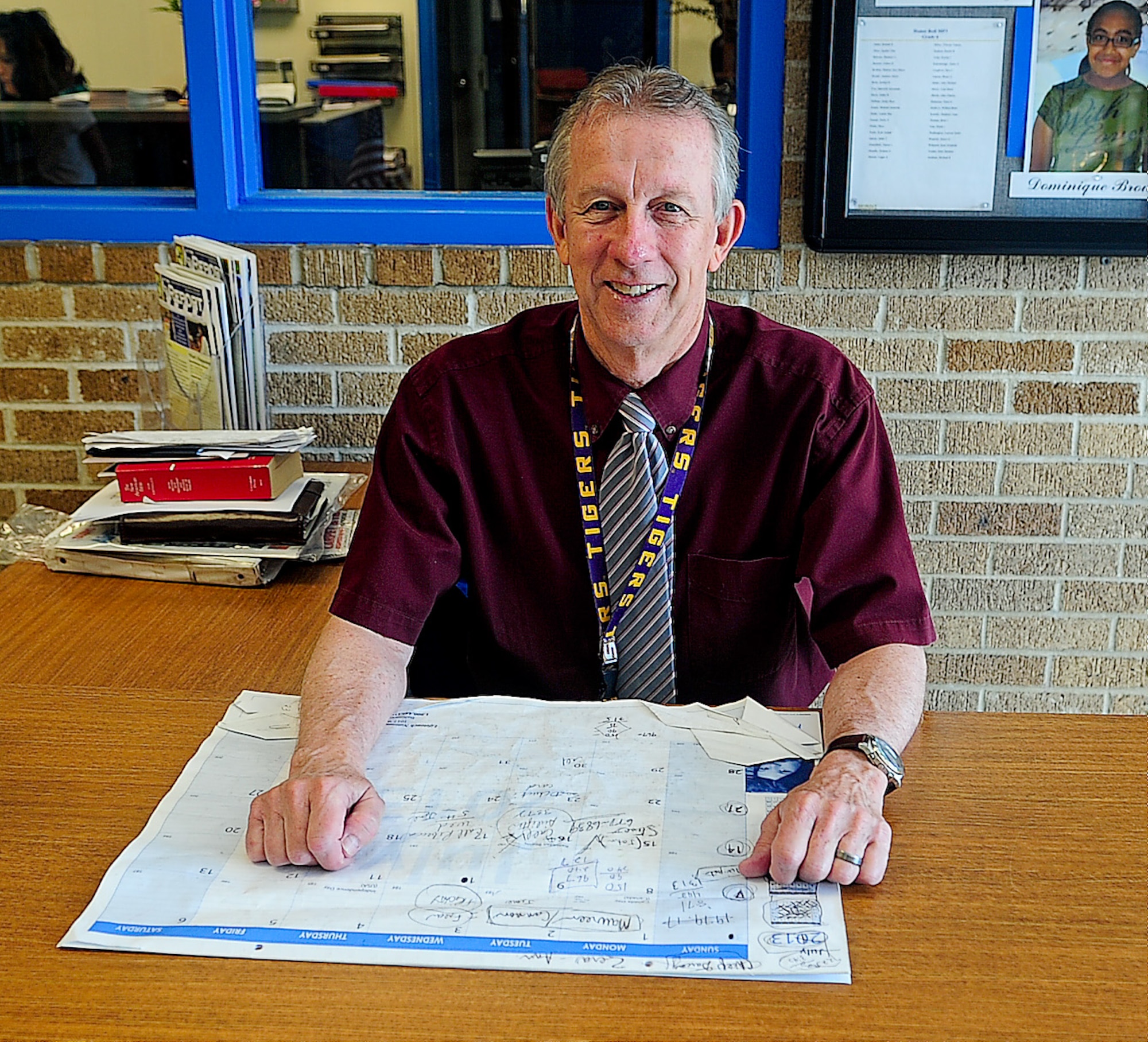 Jay Darcey, Welch Elementary and Dover Air Force Base Middle School base security liaison, sits at his desk June 5, 2013, at the elementary school on Dover Air Force Base, Del. Darcey is retiring after working for the schools for the past 12 years. (U.S. Air Force photo/Airman 1st Class Ashlin Federick)