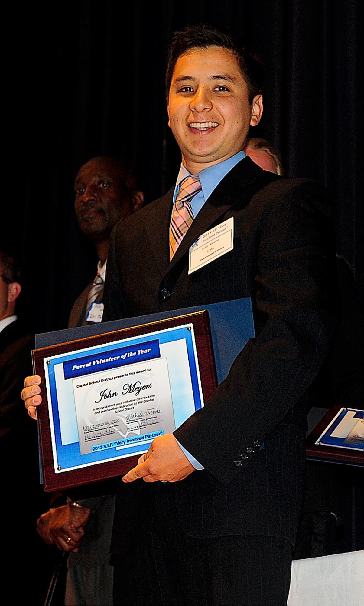 Staff Sgt. Jon Meyers, 9th Airlift Squadron flight engineer, received the Capital School District Parent Volunteer of the Year award for Central Middle School May 29, 2013, at Dover High School in Dover, Del. He won the award for coaching the CMS cross country and track teams for the last two years and accumulated more than 500 volunteer hours. (U.S. Air Force photo/Airman 1st Class Ashlin Federick)