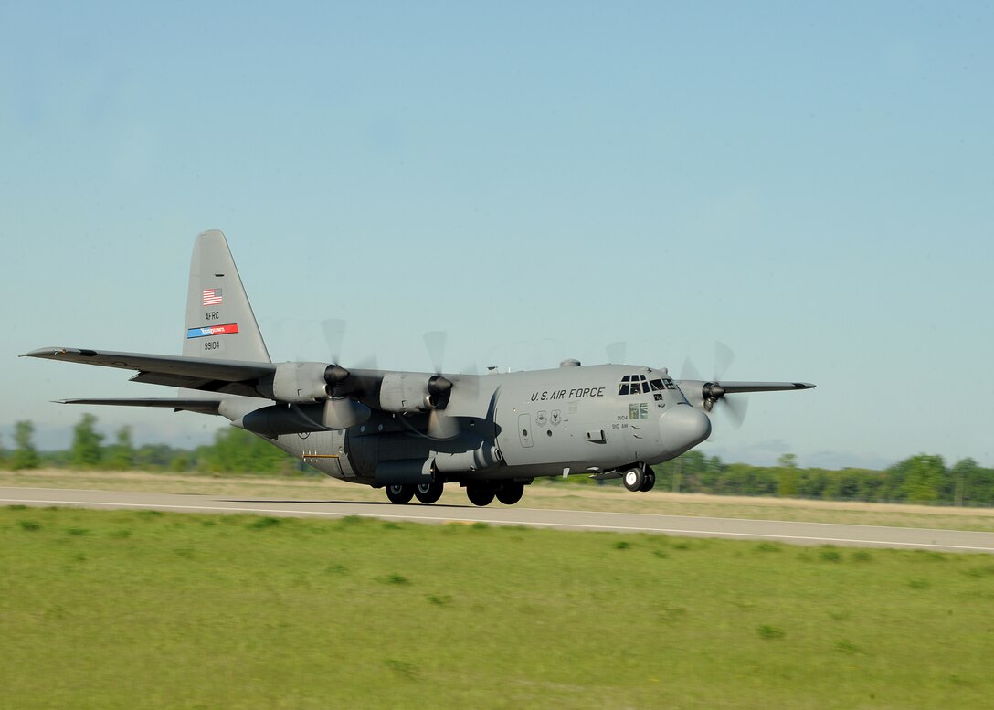 An Air Force Reserve aircrew flying a C-130 Hercules assigned to the 910th Airlift Wing, Youngstown Air Reserve Station, Ohio, takes off to begin its anti-mosquito egg spray mission on June 6, 2013, on Grand Forks Air Force Base, N.D. To allow the mosquito egg spray to effectively be dispersed, it is dumped through a pressurized set of nozzles located on both sides of the rear end of the aircraft.. (U.S. Air Force photo/Airman 1st Class Zachiah Roberson)