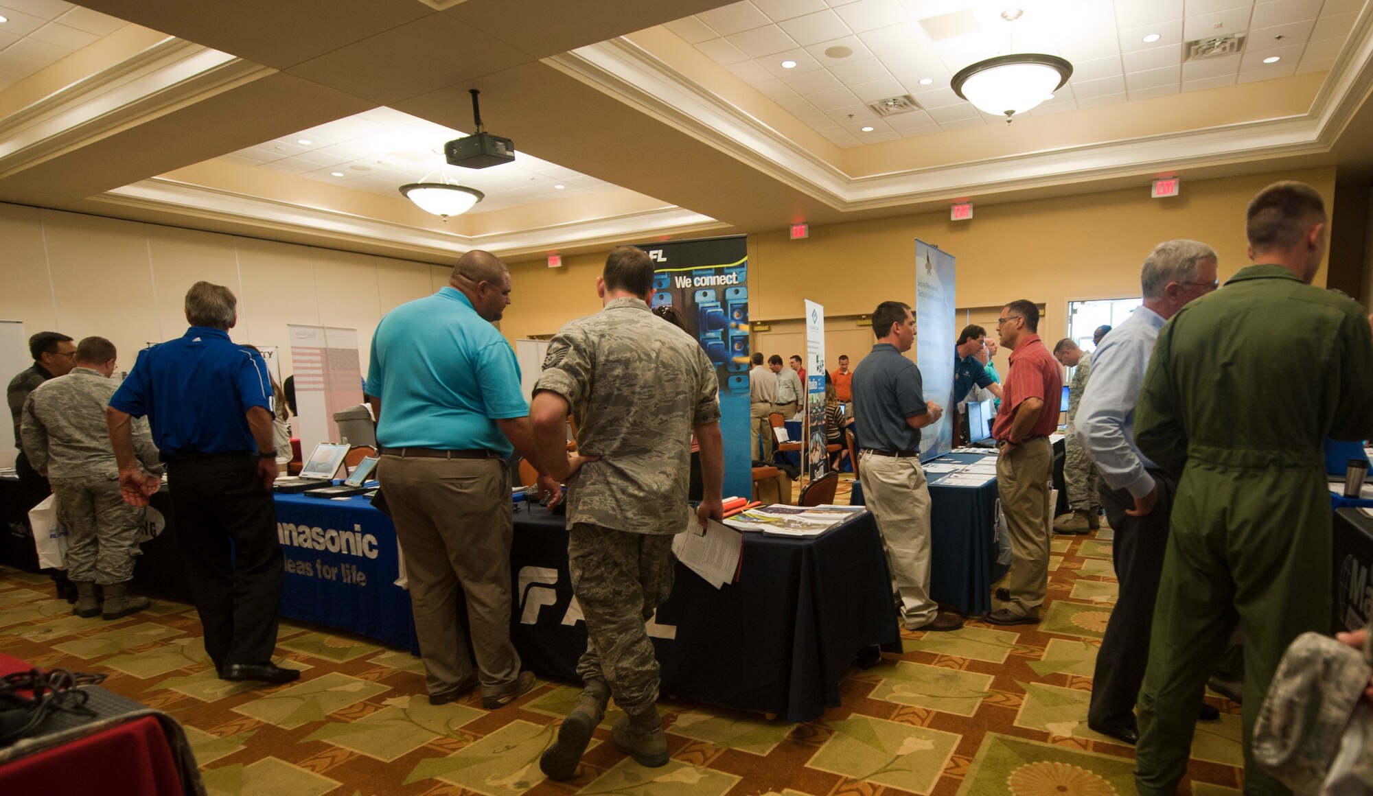 Hurlburt Field personnel attend a technology exposition at the Soundside Club on Hurlburt Field, Fla., June 4, 2013. The 1st Special Operations Communications Squadron and the Emerald Coast Armed Forces Communications and Electronics Association Chapter sponsored the event t, not only to present new technology that may be helpful to the Air Force mission, but to foster meaningful relationships to help the Air Force stay on the technological forefront. (U.S. Air Force photo by Senior Airman Krystal M. Garrett)