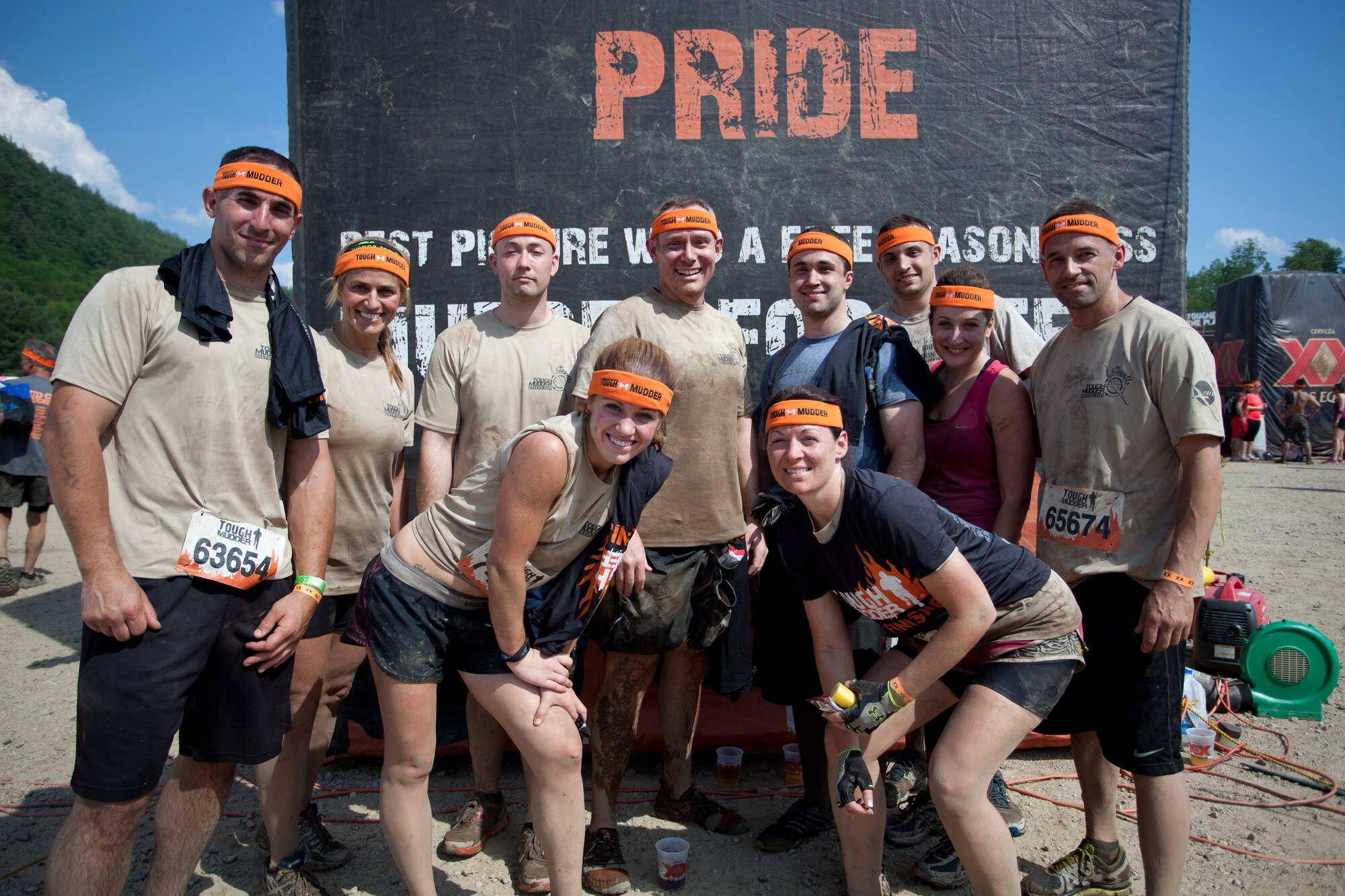 Airmen of the 102nd Intelligence Wing pose after completing the Boston Tough Mudder challenge Twenty-eight members of the 102nd Intelligence Wing challenged themselves by completing the Boston Tough Mudder event. (National Guard photo by Staff Sgt. Jeremy Bowcock/Released)