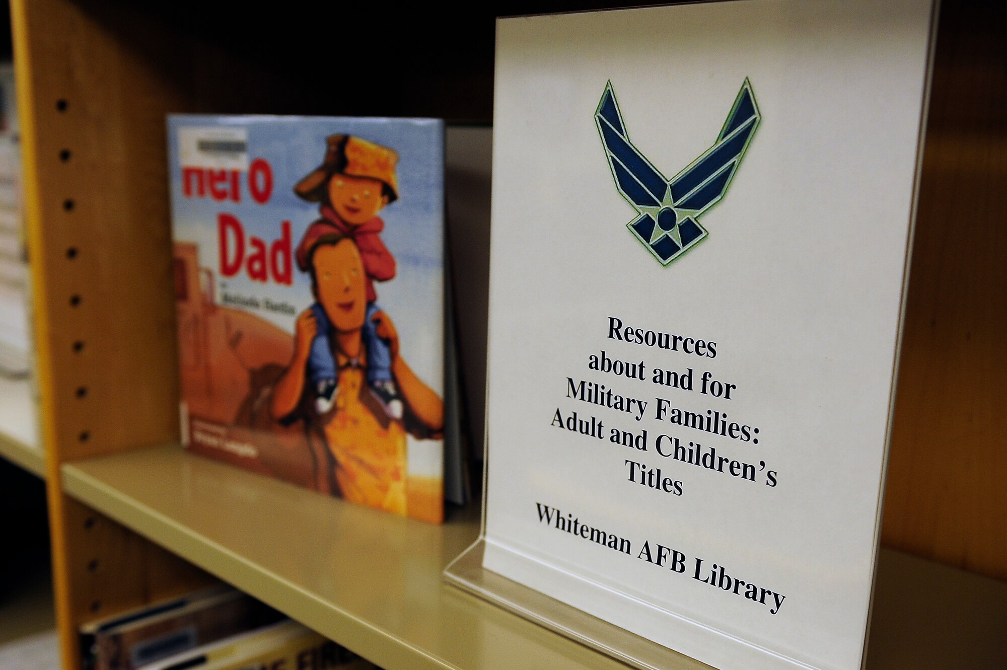 Materials to help children understand the military life line the shelves of the library at Whiteman Air Force Base, Mo., May 23, 2013. Individuals will need a library card to rent materials from the library, which they can receive by filling out a short application and presenting a Common Access Card or military ID card. (U.S. Air Force photo by Airman 1st Class Shelby R. Orozco/Released)