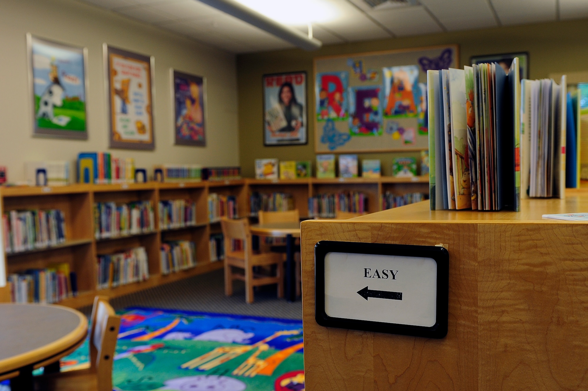 Age-appropriate books line the shelves of the children’s section of the library at Whiteman Air Force Base, Mo., May 23, 2013. The library continually updates its collection, adding between 3,000 and 4,000 titles each year.  (U.S. Air Force photo by Airman 1st Class Shelby R. Orozco/Released)