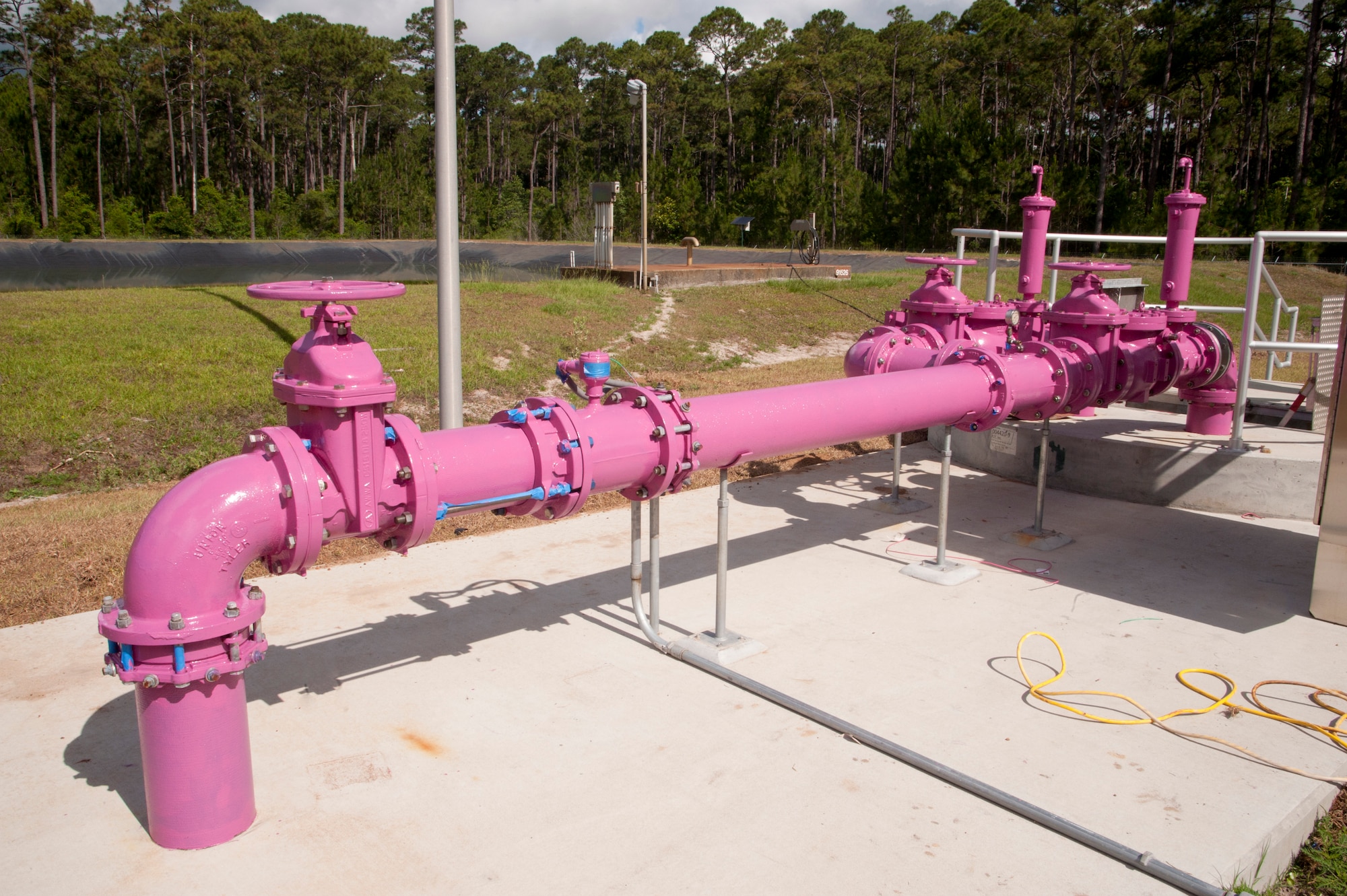 Purple pipes signify the use of reclaimed water at the Advanced Wastewater Treatment Plant on Hurlburt Field, Fla., June 4, 2013. The reclaimed water will be supplied to the CV-22 Osprey Helicopter wash rack, Air Park, community park/ball fields, Red Horse ball fields and other locations on base. (U.S. Air Force photo by Airman 1st Class Jeffrey Parkinson)