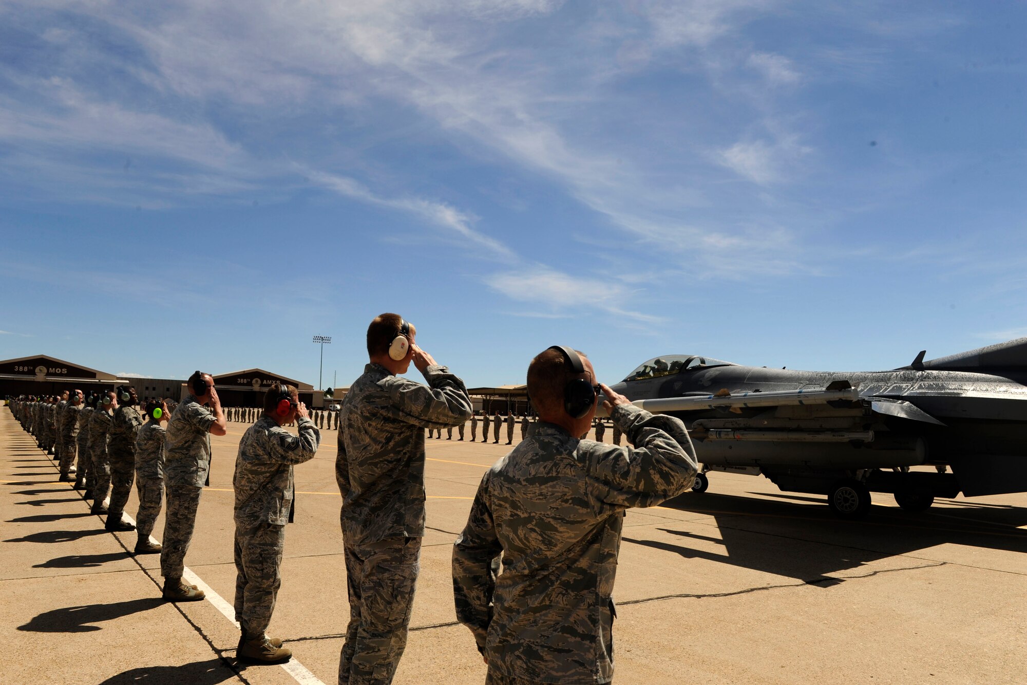 Airmen from the 388th Fighter Wing salute their commander, Col. Scott Long, as he taxis down the runway on his final F-16 flight at Hill Air Force Base, Utah, June 6, 2013. Long is a command pilot with more than 2,900 flying hours, including more than 130 combat missions in support of Operations Desert Storm, Southern Watch and Enduring Freedom. (U.S. Air Force photo/Airman 1st Class Scott Jackson/Released)

