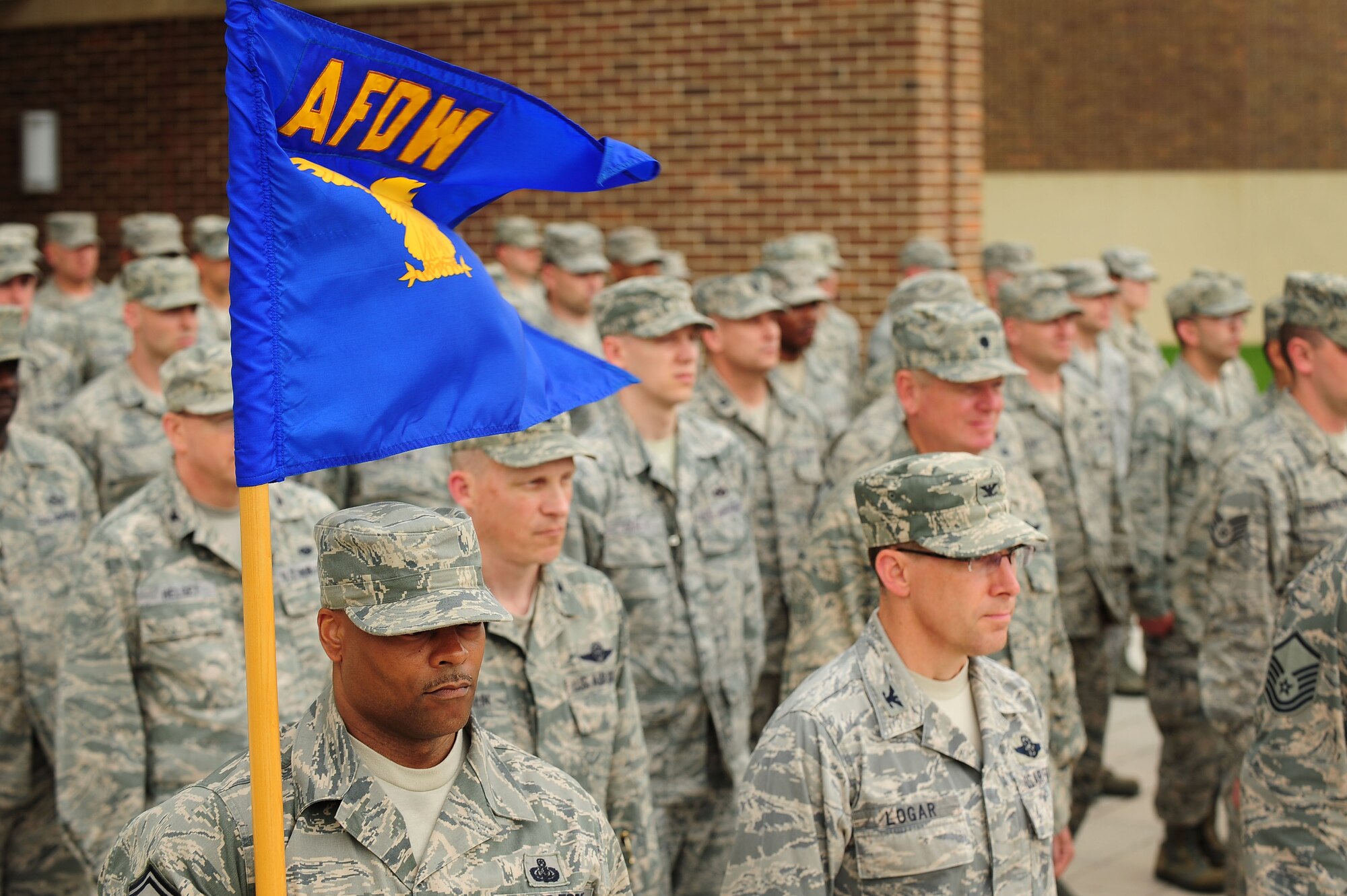 Headquarters Air Force District of Washington Staff Airmen stand in formation during a retreat ceremony, June 6, 2013, at Joint Base Andrews, Md. AFDW?s vision is ?Ready Airmen, Renowned for Excellence.? (U.S. Air Force photo by Senior Airman Steele C. G. Britton)