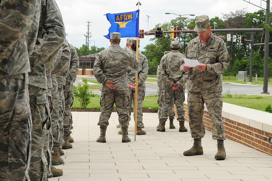 Air Force District of Washington Vice Commander Col. Michael E. Gantt addresses Headquarters AFDW Staff Airmen during a retreat ceremony, June 6, 2013, at Joint Base Andrews, Md. Gantt read a speech that Gen. Dwight D. Eisenhower gave, June 6, 1944, to 160,000 Allied troops that landed along a 50-mile stretch of heavily-fortified French coastline to fight Nazi Germany on the beaches of Normandy, France. (U.S. Air Force photo by Senior Airman Steele C. G. Britton)