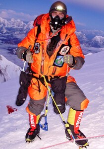 Capt. Marshall Klitzke, an instructor pilot with the 557th Flying Training Squadron at the U.S. Air Force Academy, Colo., poses for a photo at the summit of Mt. Everest, May 20, 2013.  Klitzke climbed Mt. Everest with the U.S. Air Force Seven Summits Challenge team, an independent group of Airmen who, through the sport of mountain climbing, aim to spread goodwill about the Air Force.  According to Klitzke, who has also climbed Mt. Rainier in Washington and Ama Dablam in Nepal, the group is the first military team to scale all seven and the first U.S. military team to summit Mt. Everest.  (Courtesy Photo)