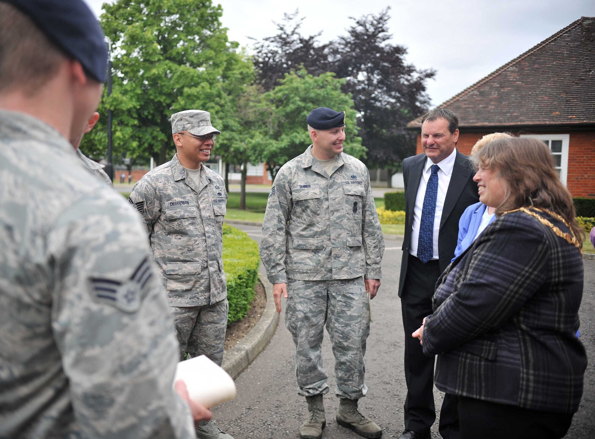 Representatives from Ely Town Council's Christmas Lights committee thank Airmen June 10, 2013, at RAF Mildenhall, England. The committee members visited the base to present certificates of appreciation to Airmen who helped with the 2012 Ely Christmas lights project. (U.S. Air Force photo by Staff Sgt. Jerilyn Quintanilla/Released)