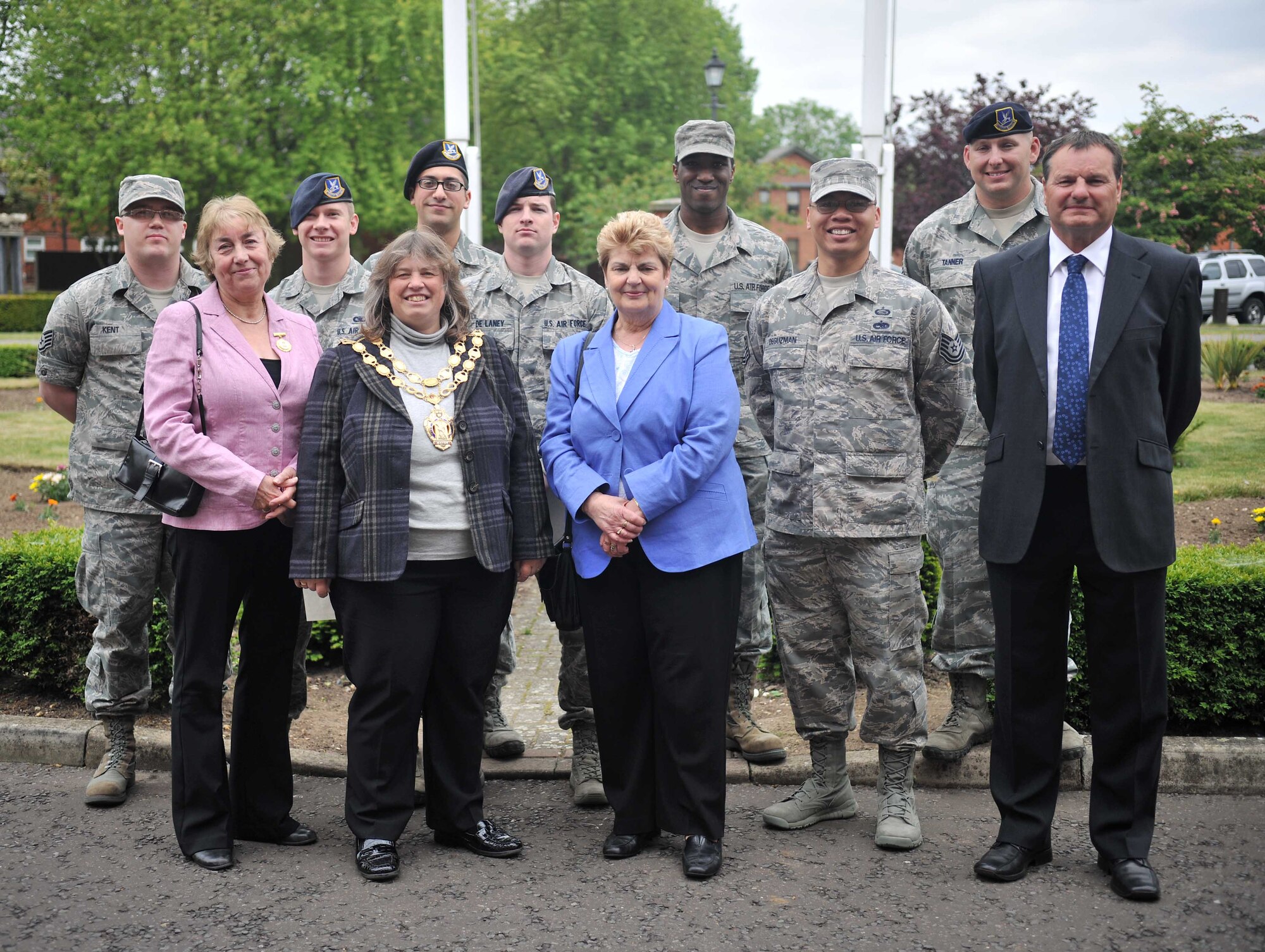 Ely Town Council members pose for a group photo with Airmen June 10, 2013, at RAF Mildenhall, England. More than 90 Airmen from various bases throughout the U.K. assisted with the set up and tear down of Christmas lights throughout the town. (U.S. Air Force photo by Staff Sgt. Jerilyn Quintanilla/Released) 