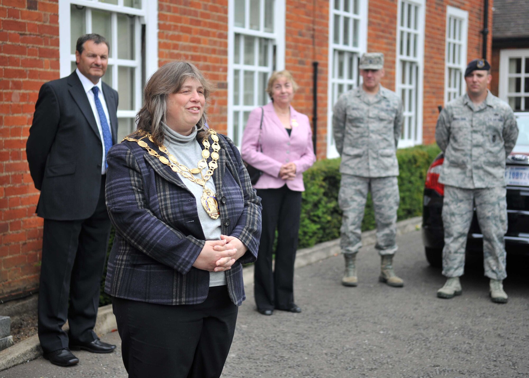 Elaine Griffin-Singh, Councillor of Ely, speaks to Airmen June 10, 2013, at RAF Mildenhall, England. The councillor, along with Ely Town Council's Christmas Lights Committee representatives, presented certificates of appreciation to several Airmen who volunteered for the town’s Christmas lights project last year. Airmen from various Royal Air Force bases including RAF Mildenhall, RAF Lakenheath and RAF Alconbury volunteered for the event. (U.S. Air Force photo by Staff Sgt. Jerilyn Quintanilla/Released)
