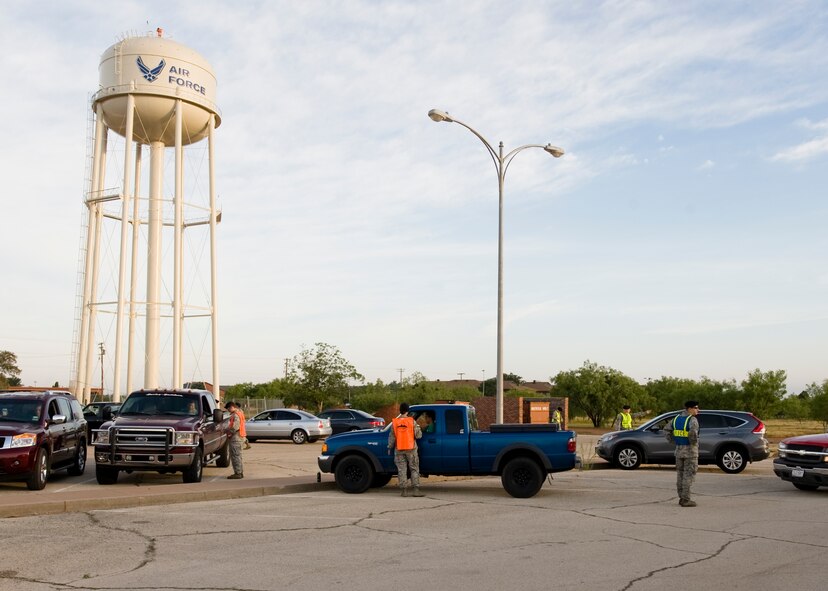 Several vehicles are processed at one of three inspection points on base June 7, 2013, at Dyess Air Force Base, Texas. The Roadway Blitz was a friendly reminder to on-base motorists to have all vehicle documentation up to date assuring compliance with state and base regulations. (U.S. Air Force photo by Airman 1st Class Peter Thompson/Released) 