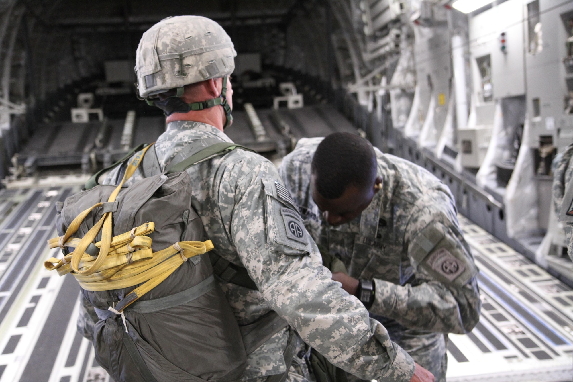 Master Sgt. Robert Edwards conducts a Jump Master Personnel Inspection on a paratrooper inside a C17 Globemaster III prior to insert jumping on Keno Drop Zone, Nellis Air Force Base, during Joint Forces Exercise-Vulnerability on May 31, 2013. (Photo by: Maj. Loren Bymer)
