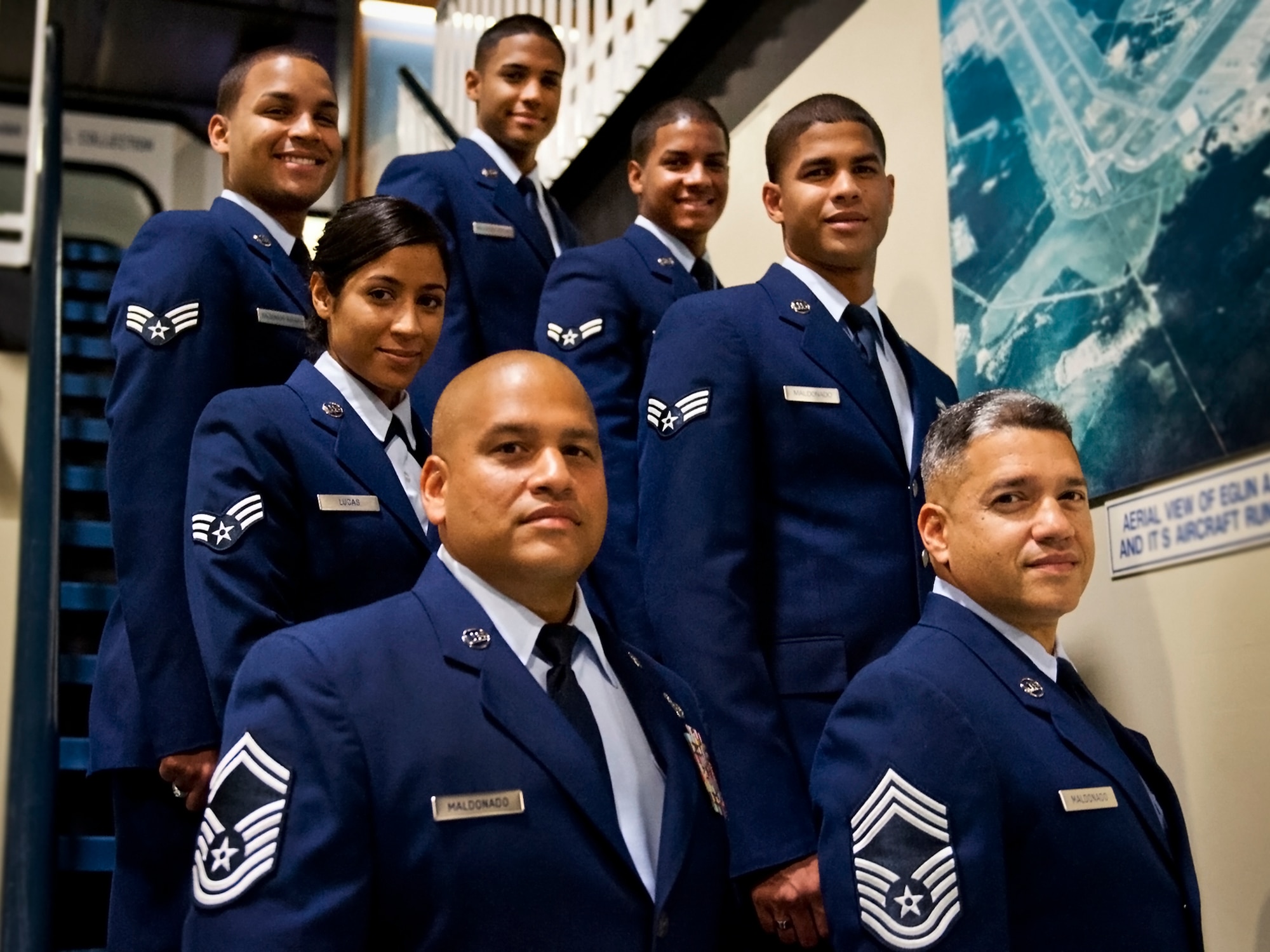 On June 7, the Maldonado family traveled from around the world for Senior Master Sgt. David Maldonado's retirement from Det. 1, 552nd Air Control Squadron. It's the first time the seven siblings, all active-duty Air Force, have been in uniform and in one place at the same time since leaving home. Pictured are Chief Master Sgt. John Maldonado (Aviano AB, Italy), Senior Master Sgt. David Maldonado (Eglin AFB, Fla.), Senior Airmen Emmanuel Maldonado (Keesler AFB, Miss.),  Karla Lucas (Holloman, AFB, N.M.), and Juan Maldonado (Kirtland AFB, N.M.), Airmen 1st Class Marcos Maldonado (Camp Darby, Italy) and Ernesto Maldonado (Barksdale AFB, La.). (U.S. Air Force photo/Sara Vidoni)