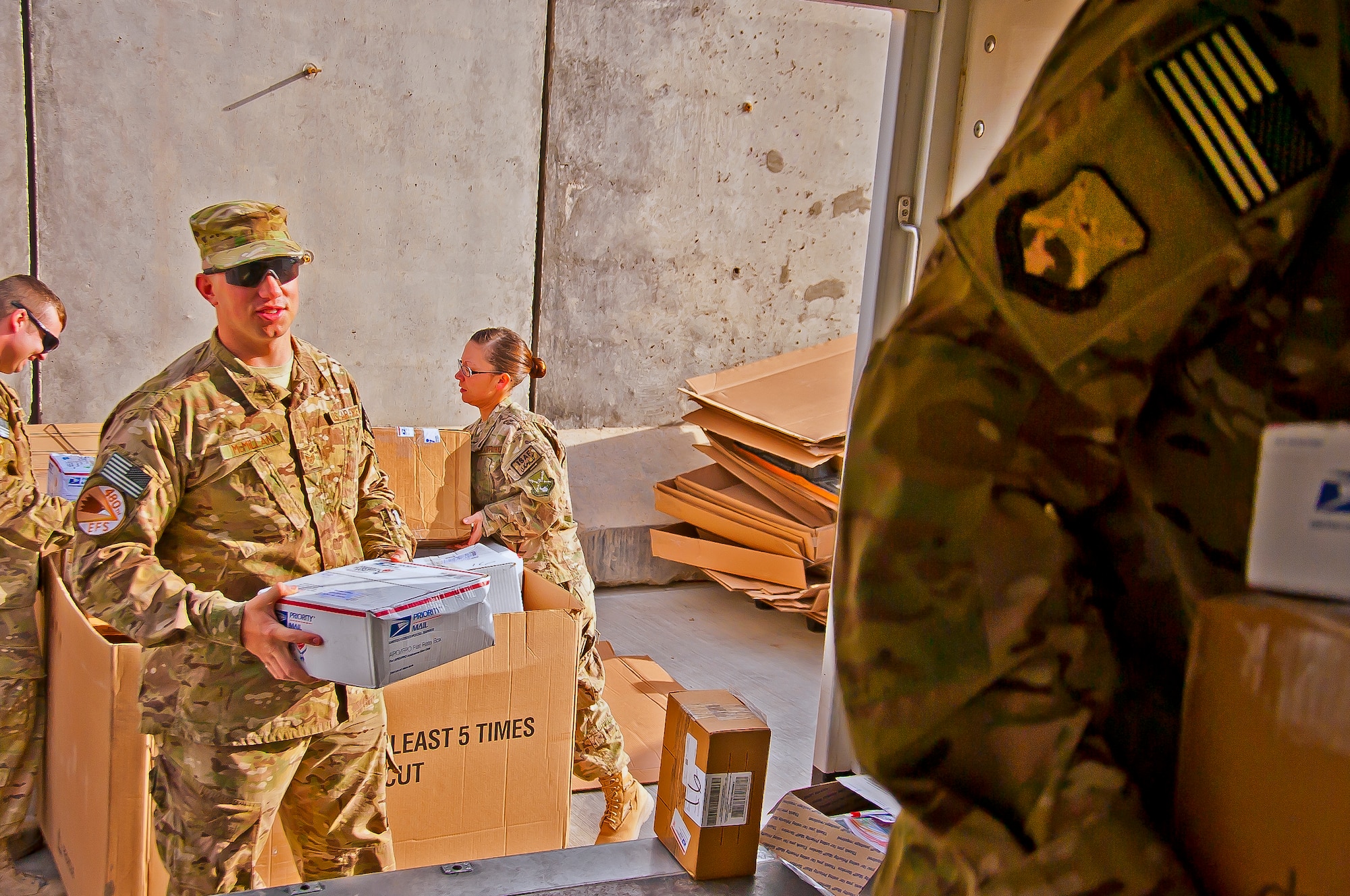 U.S. Air Force Staff Sgt. Joshua McMillian, 480th Expeditionary Fighter Squadron, gathers incoming mail at the mail storage yard at Kandahar Airfield, Afghanistan, May 10, 2013. Airmen from across the 451st Air Expeditionary Wing here assist the wing mail custodian every day to gather, sort and distribute mail amongst Air Force personnel. (U.S. Air Force/photo Senior Airman Scott Saldukas)