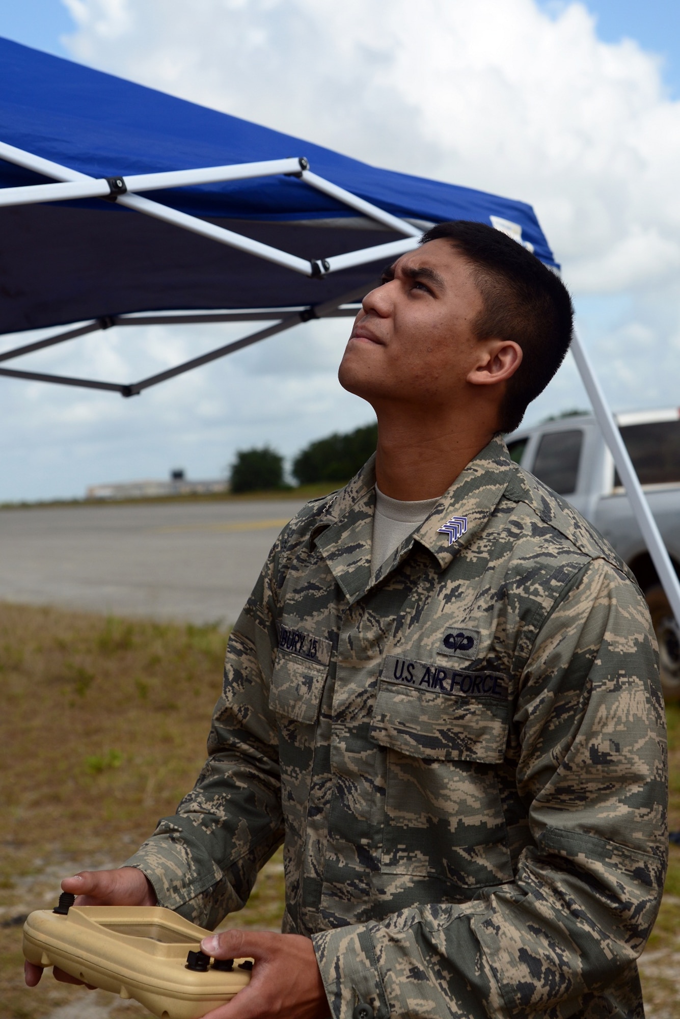 U.S. Air Force Academy Cadet 2nd Class Jacob Seabury controls an RQ-11B Raven Small Unmanned Aircraft System June 5, 2013 at Choctaw Airfield, Fla. The Raven can provide color and infrared video directly to the control station. (U.S. Air Force photo by Staff Sgt. Melanie Holochwost)