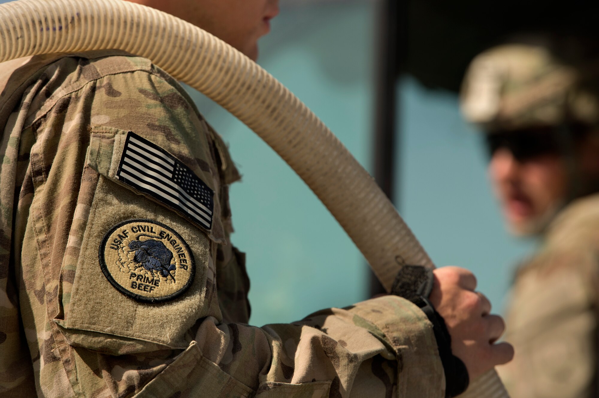 Airman 1st Class Brandon Devine, 577th Expeditionary Prime Base Engineer Emergency Force Squadron, assists filling up a Tool Cat with water as part of the runway rubber removal process at Forward Operating Base Shank, Logar province, Afghanistan, June 5, 2013. Runway maintenance is a composite team built from many civil engineering backgrounds. Devine, haling from Gadsden, Ala., is a pavement and heavy equipment "Dirt Boy." (U.S. Air Force photo/Master Sgt. Ben Bloker)