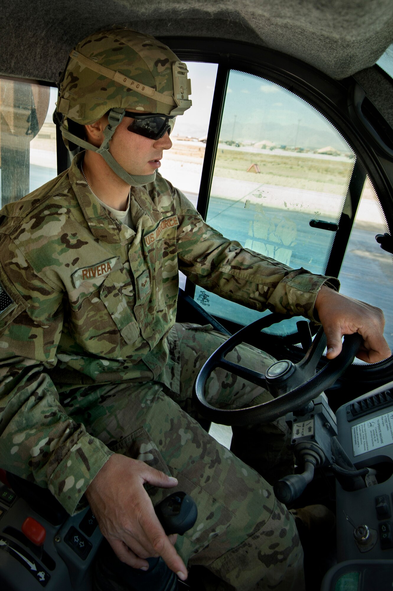 Senior Airman Jessie Rivera, 577th Expeditionary Prime Base Engineer Emergency Force Squadron, uses an angle brush-equipped Tool Cat to agitate a water and chemical process, which removes rubber from a runway at Forward Operating Base Shank, Logar province, Afghanistan, June 5. Runway maintenance is a composite team built from many civil engineering backgrounds. Rivera, hailing from Denver, is an electrical power production technician by trade. (U.S. Air Force Photo/Master Sgt. Ben Bloker)