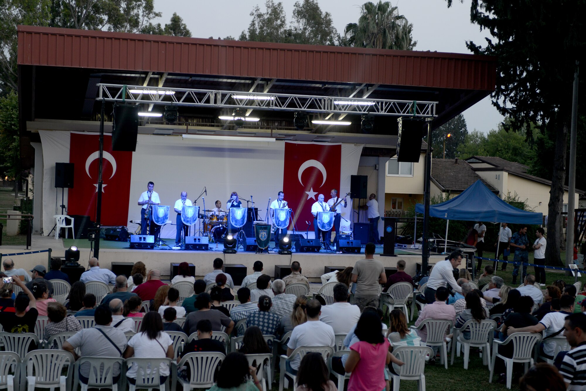 The Turkish Air Force Jazz Band plays a concert for an American and Turkish audience in Arkadas Park June 9, 2013, at Incirlik Air Base, Turkey. The Turkish air force celebrated its 102nd anniversary by inviting members of the Incirlik community to view static displays and enjoy a performance from their jazz band. (U.S. Air Force photo by Tech. Sgt. Dallas Edwards/Released)