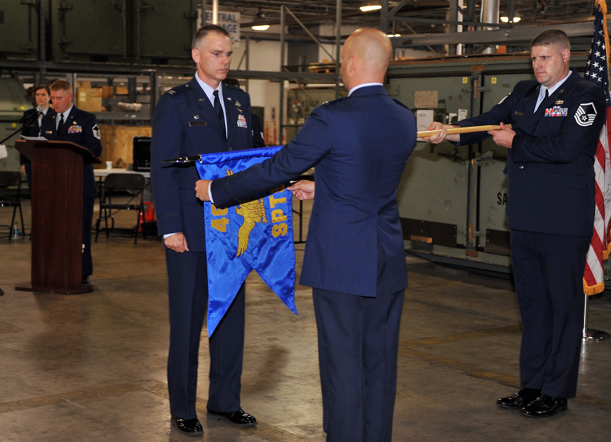 Col. David Foote, 461st Maintenance Group commander, watches as Lt. Col. Robert Dunlap, 461st Support Squadron commander, cases the unit colors during the 461st Support Squadron inactivation ceremony June 6, 2013. (U.S. Air Force photo by Tommie Horton)