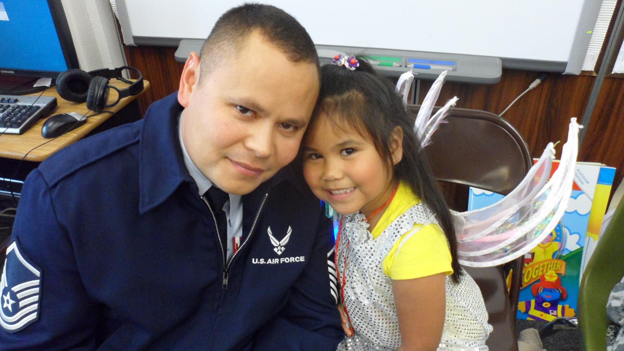 Master Sgt. Edward Timmons, 353rd Special Operations Group, poses for a picture with his daughter, Isabella, 7, recently at his daughter school.  In the past year, Timmons has had two major surgeries and completed radiation treatments to help battle thyroid cancer.  Timmons looks forward to hitting his one year mark in  September, so he can officially be in remission.  (Courtesy photo) 