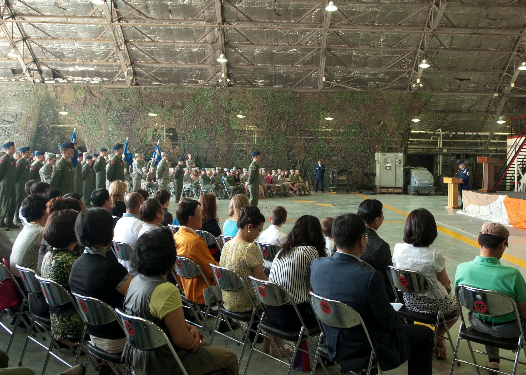 Members of Team Osan wait for the start of the 51st Operations Group change of command ceremony at Osan Air Base, Republic of Korea, June 7, 2013. During the ceremony, the group bid farewell to the outgoing commander, Col. Keith McBride, and welcomed their new commander, Col. James Clark, who recently served as the deputy commander of the 23rd Fighter Group at Moody Air Force Base, Ga. (U.S. Air Force photo/Senior Airman Siuta B. Ika)