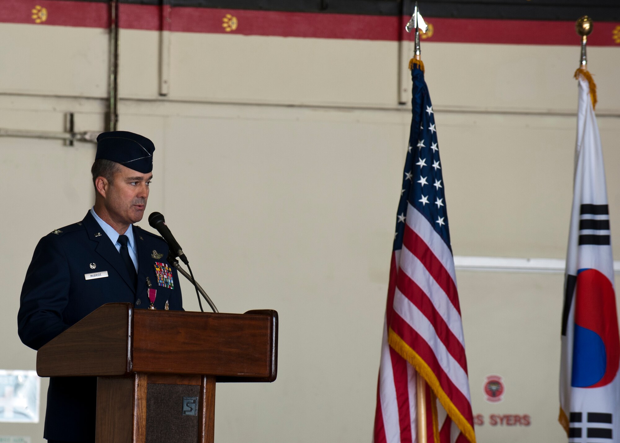 Col. Keith McBride, outgoing 51st Operations Group, speaks during the 51st OG change of command ceremony at Osan Air Base, Republic of Korea, June 7, 2013. As the 51st OG commander, McBride led more than 265 personnel and directed operations for A-10 Thunderbolts, F-16 Fighting Falcons and operations support squadrons. (U.S. Air Force photo/Senior Airman Siuta B. Ika)