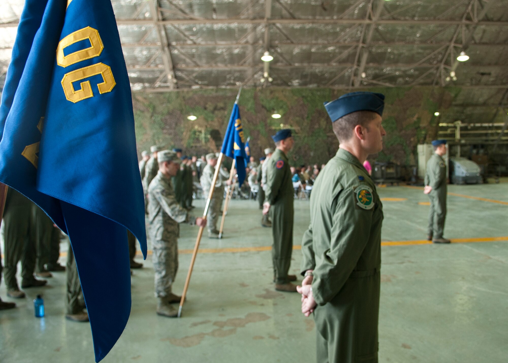 Members of the 51st Operations Group stand at parade rest during the 51st OG change of command ceremony at Osan Air Base, Republic of Korea, June 7, 2013. During the ceremony, the group bid farewell to the outgoing commander, Col. Keith McBride, and welcomed their new commander, Col. James Clark, who recently served as the deputy commander of the 23rd Fighter Group at Moody Air Force Base, Ga. (U.S. Air Force photo/Senior Airman Siuta B. Ika)