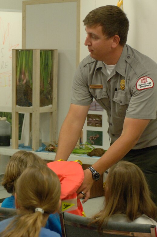 U.S. Army Corps of Engineers Nashville District Park Ranger Dean Austin from Cheatham Lake encourages kids to properly wear a life jacket when near or in water during the 2013 Junior Gardener Camp at the Agricultural Exposition Center in Franklin, Tenn., June 7, 2013.